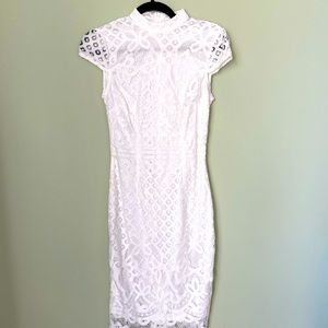 White lace dress with high color. Fitted and pretty lace detailing on edges